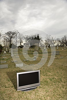 Television in graveyard.