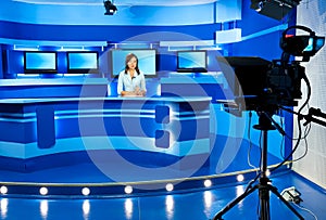 Television newscaster at blue TV studio photo