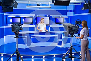 Television newscaster and teleoperator at TV studio