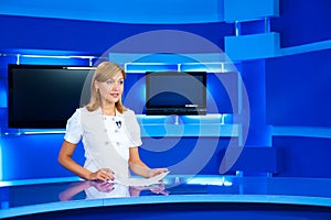 Television newscaster at TV studio