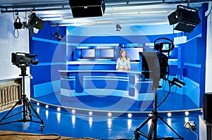 Television newscaster at TV studio
