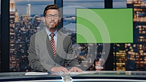 Television presenter point green screen talk evening news. Man ending newscast photo