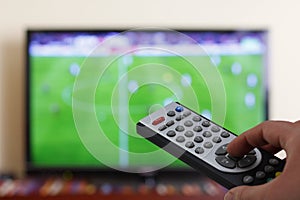 Television remote control in the hand, zapping