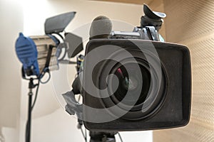 Television studio with camera and lights. Digital TV camera