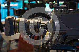 Television studio with camera and lights - recording TV show. Shallow depth of field