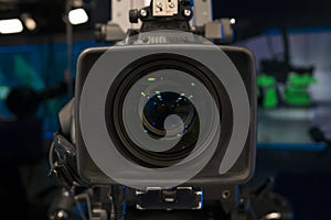 Television studio with camera and lights - recording TV show. Shallow depth of field