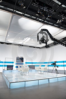 Television studio with jib camera and lights