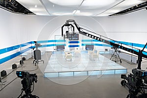 Television studio with jib camera and lights