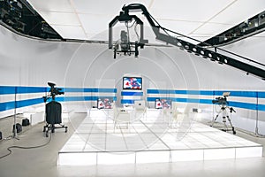 Television studio with jib camera and lights