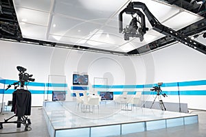 Television studio with jib camera and lights photo