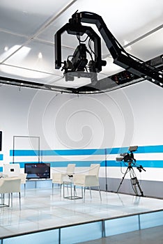 Television studio with jib camera and lights photo