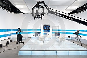 Television studio with jib camera and lights