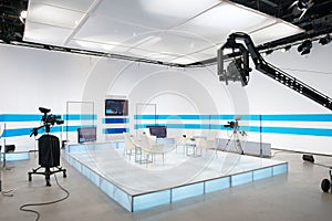 Television studio with jib camera and lights photo