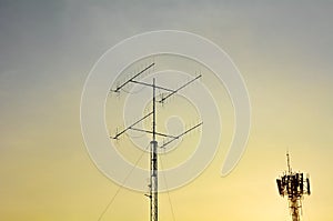 Televisions antenna and telecommunication tower antenna with sunset.