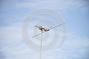 Televisions antennas with clear sky.