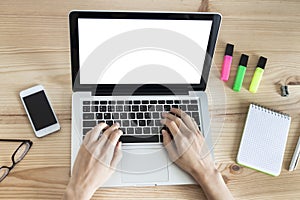 Teleworker woman using laptop computer with blank screen photo