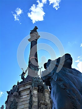 The Columbus Monument and the lion in Barcelona city, Spain. Art, history and elevation