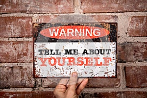 Tell Me About Yourself. Warning sign with text