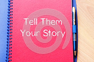 Tell them your story write on notebook