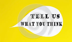 Tell Us What You Think speech bubble isolated on the yellow background photo