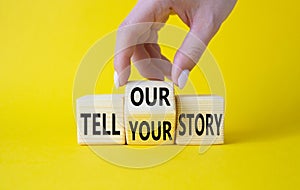 Tell Your or Our story symbol. Businessman hand turns wooden cubes and changes the words Tell Your story to Tell Our story.