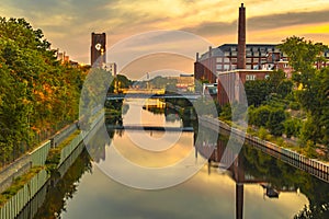 The Teltow Canal in Berlin-Tempelhof, Germany, overlooking bridges and old factory buildings in the light of the sun