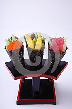 Temaki Sushi, Tobiko, Tamagoyaki and Tuna isolated on whote back