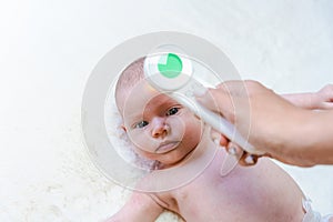 Temperature baby child sick. Doctor check cold flu baby care health from electronic thermometer. Child sick, kid health