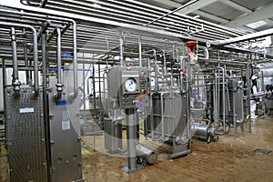 Temperature control valves and pipes in dairy production factory