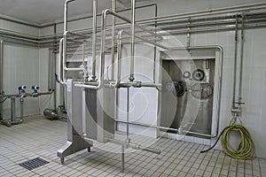 Temperature controlled pressure tanks and valves in factory photo