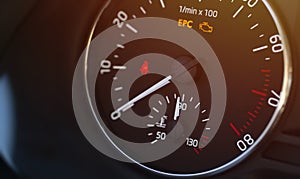 Temperature, engine revolutions and warning lights on the vehicle display photo
