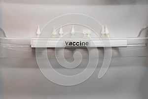 Temperature issues with coronavirus vaccine storage in refrigerators and freezers. Flask of medicine against the virus on the