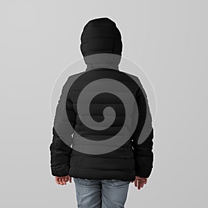 Template black winter kids puffer jacket on girl, warm clothing for cold weather, back view, presentation for design, branding