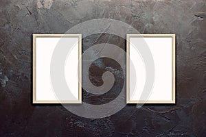 Template of blank posters in wooden frames on texturized brown stucco wall