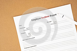 Template of an Employee incident report form document and and pen on blue background