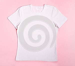Template of women's white blank t-shirt on a pink background for the layout of your design for printing