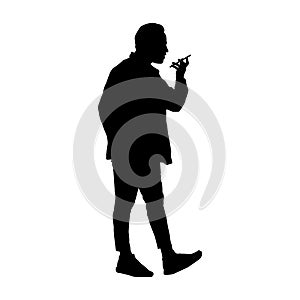 Silhouette of a man talking on a cell phone