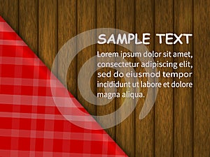 Template for your design. red checkered tablecloth on a wooden table, an example of the text.