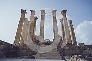 Temple in the Ancient Roman city of Gerasa, modern Jerash, Jordan.Old columns of ancient buildings on the blue sky. Ancient Roman