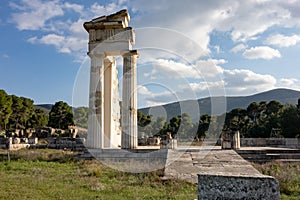 Temple of Asklepios at Epidaurus with stone blocks at early sunset with boulders around photo