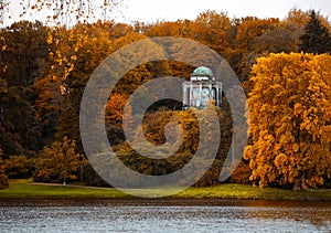 Temple of athena nestled on the bank of a autumn forest