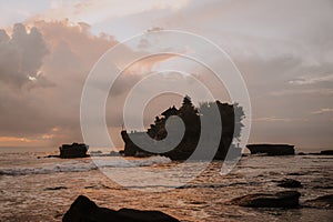 Tanah Lot Temple. Tanah Lot water temple in Bali during sunset. Famous hindu temple main Bali landmark. Indonesia