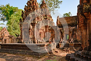 Temple Banteay Srei, Cambodia. Ruins of Hindu Temple Banteay Srei near Angkor Wat. Monkey guards in front of temple entrance