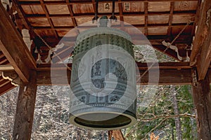 Temple bell hanging stationary with scriptures