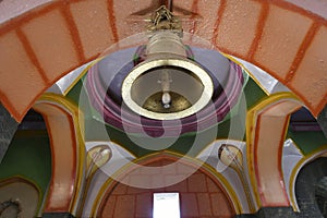 Temple bell at the well painted archway entrance at Bhairavnath Temple, Saswad, Pune