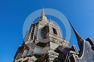 Temple building, Wat Po, Thailand. Colored exterior blue sky above. photo