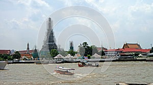 Temple of the dawn on Chaophraya River side under renovation