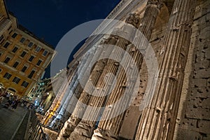 The Temple of the Divine Adrian at night in Rome