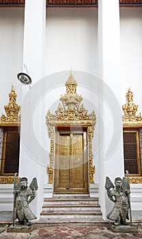 Temple Entrace with Stone Chinese Guadians at Wat Pho, Bangkok, Thailand