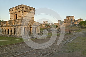 Temple of the Frescoes at the Mayan ruins of Ruinas de Tulum (Tulum Ruins). El Castillo is pictured in the background, in Quintana photo